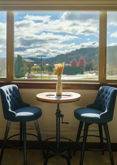 Coffee for two with the view right outside the glass at Riverstone Mountain View Condo, Coeur d'Alene Idaho