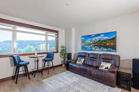 Relax in the light-filled living room at Riverstone Mountain View Condo, Coeur d'Alene Idaho
